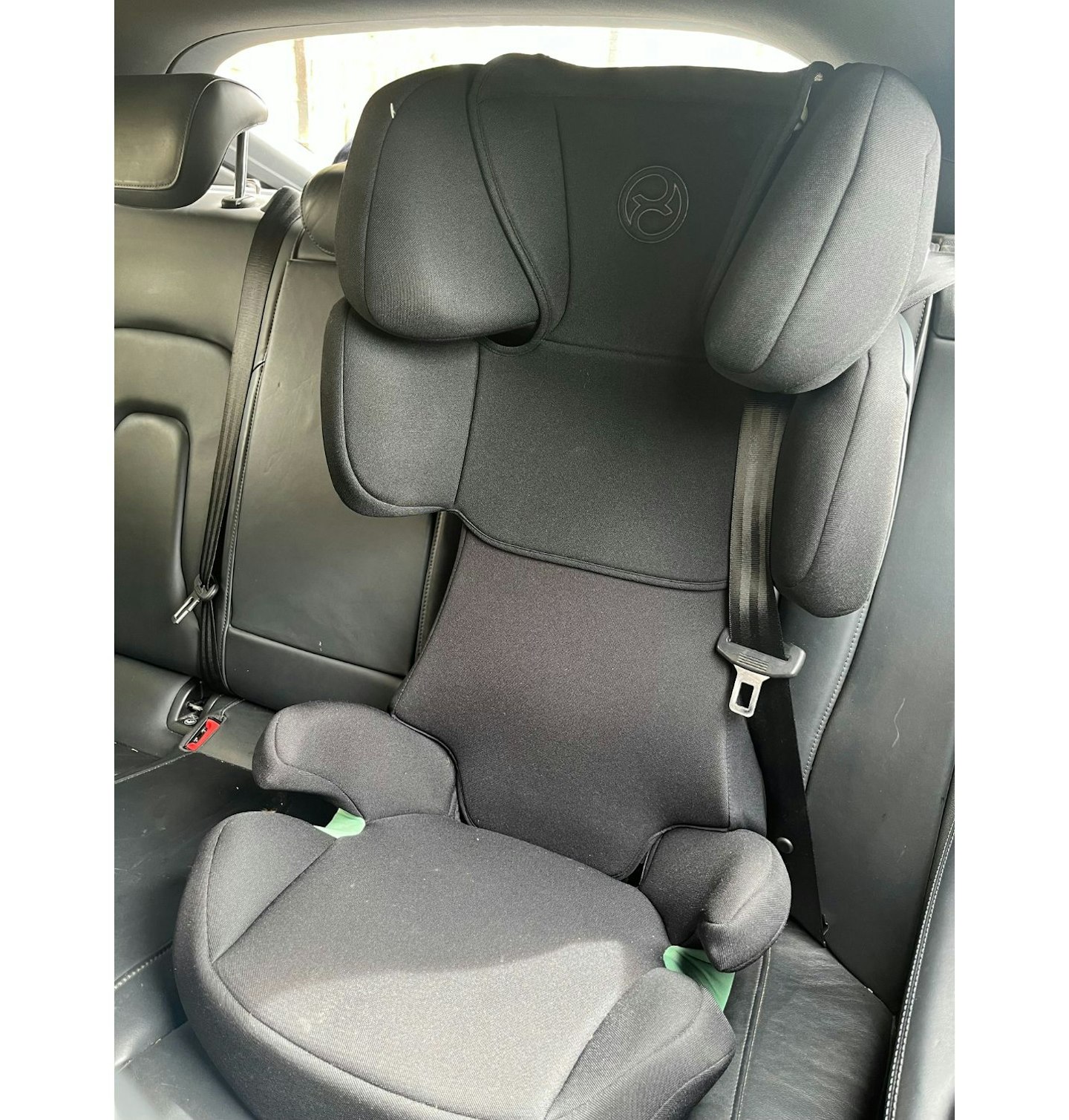 Cybex Silver Solution X-Fix Child's Car Seat being tested with a seatbelt.