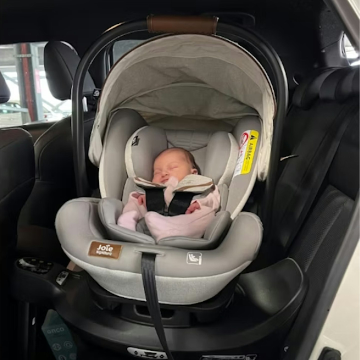 young baby sleeping in the Joie i-Level car seat