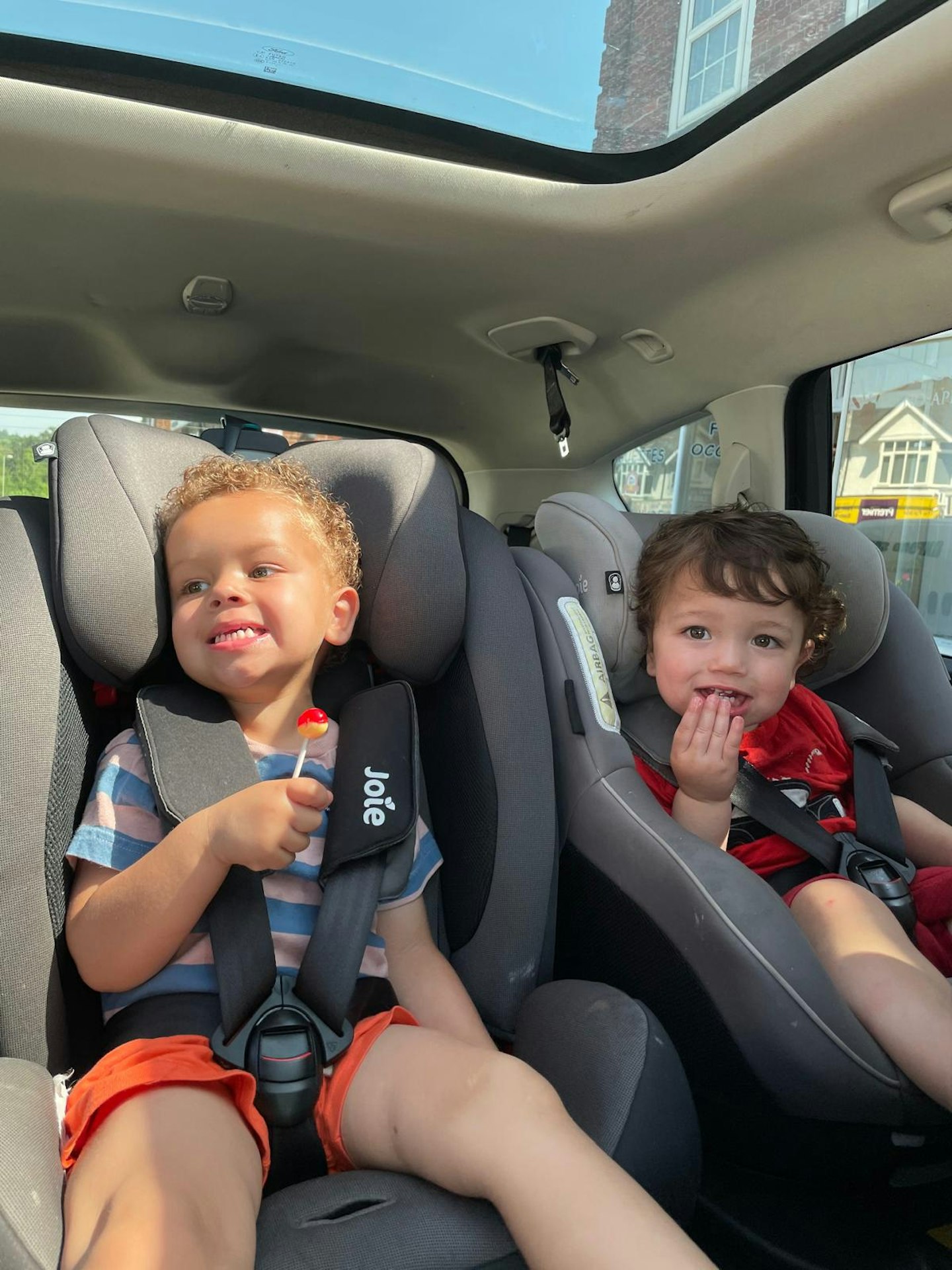 Mother&Baby writer Hannah Carrolls's sons in two Joie car seats.