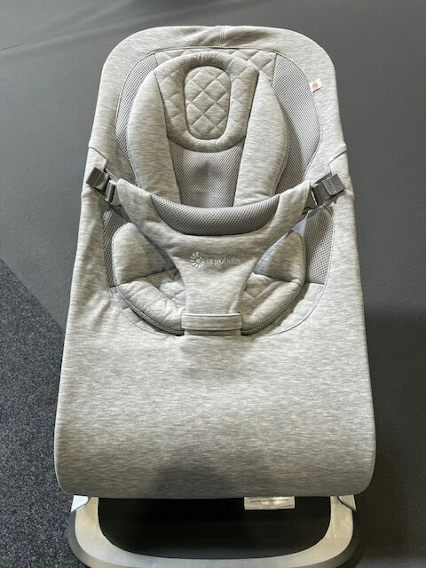 light grey baby bouncer  
Ergobaby Evolve 3-in-1 Bouncer