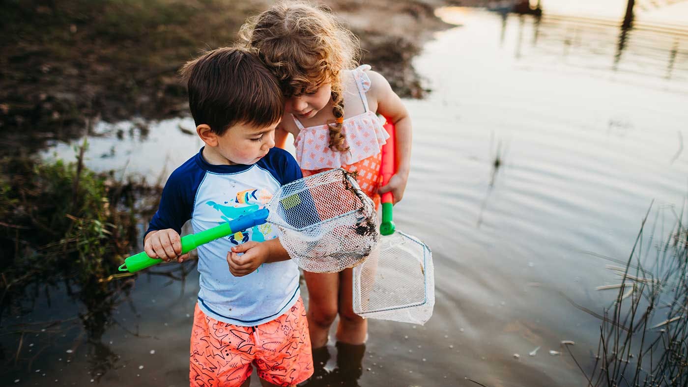 Two young children with fishing nets