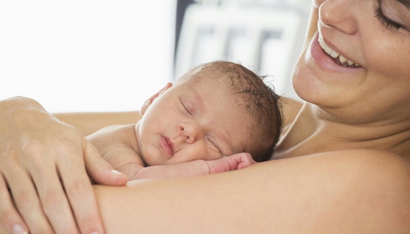woman holding newborn baby