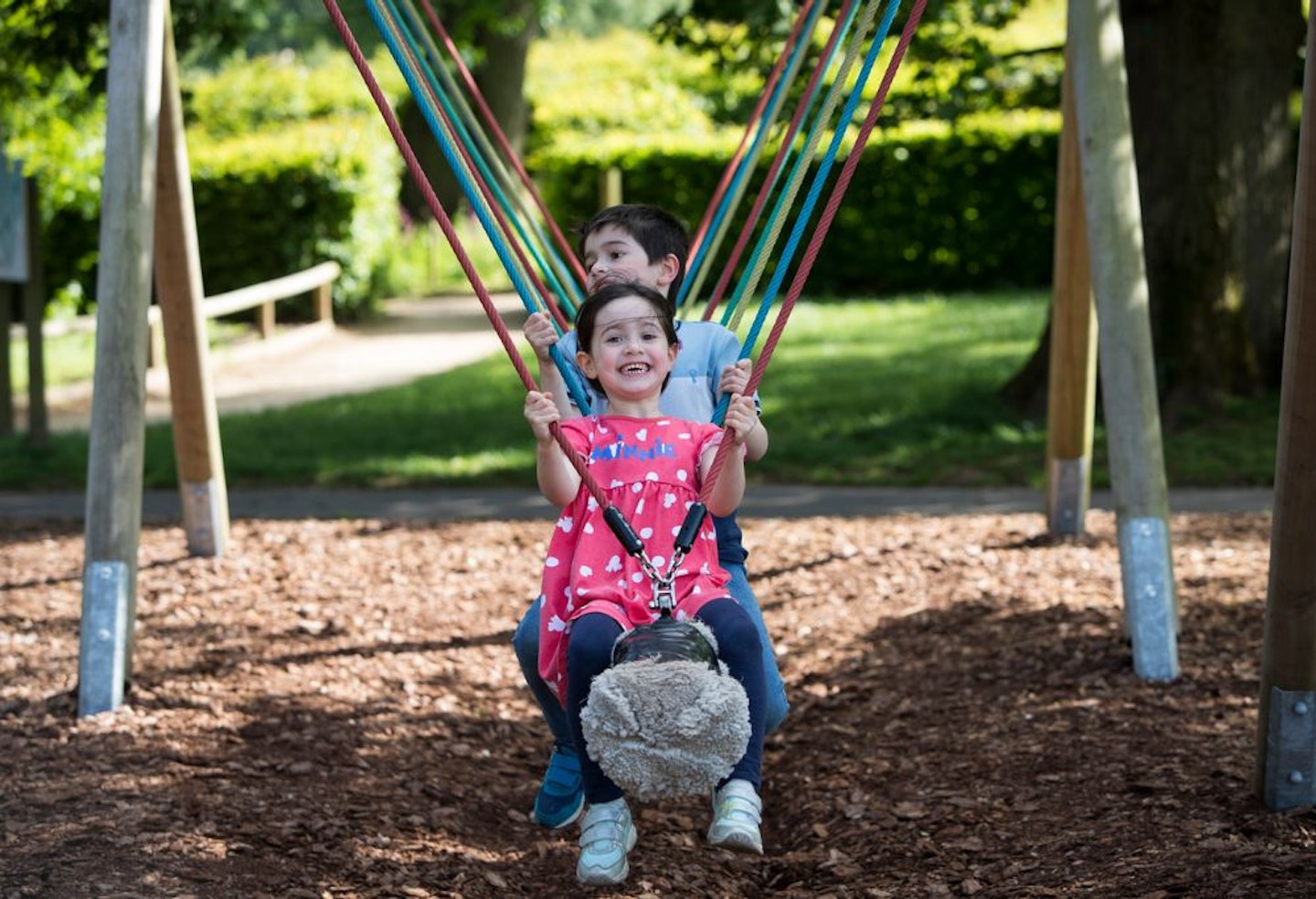 Children on a log swing at Trentham Gardens