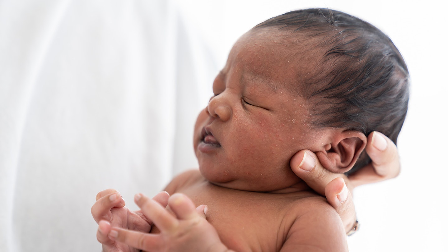 newborn baby with closed eyes