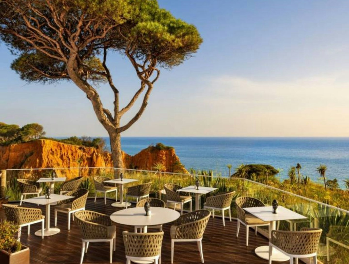 Mirador Champagne Bar at Pine Cliffs Resort, with tables looking out over the ocean