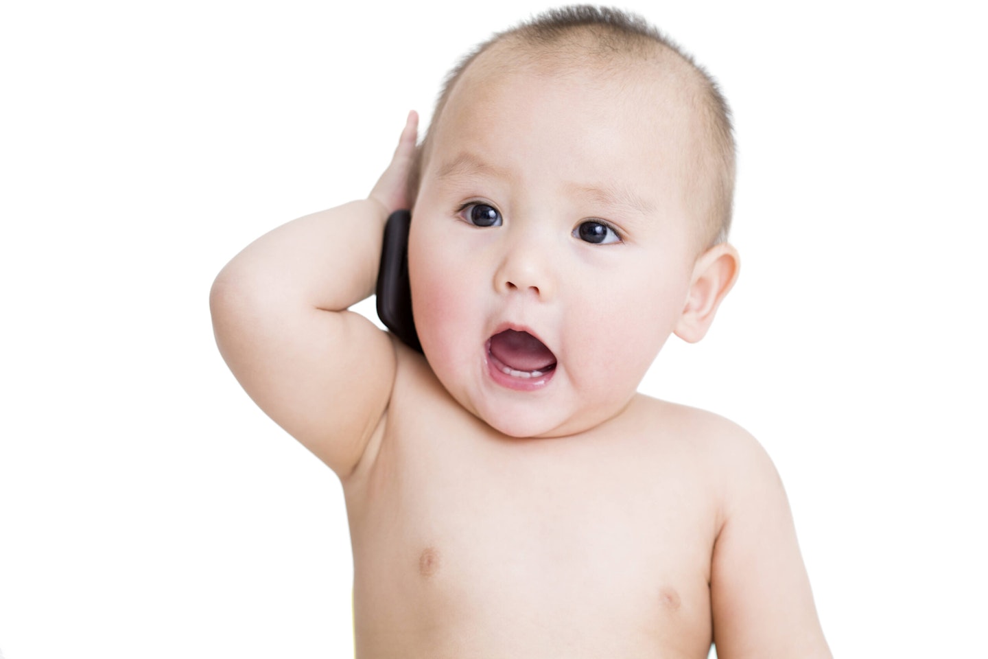 A Chinese baby holding a phone to his ear