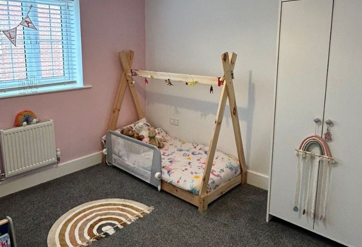 A toddler floor bed being tested