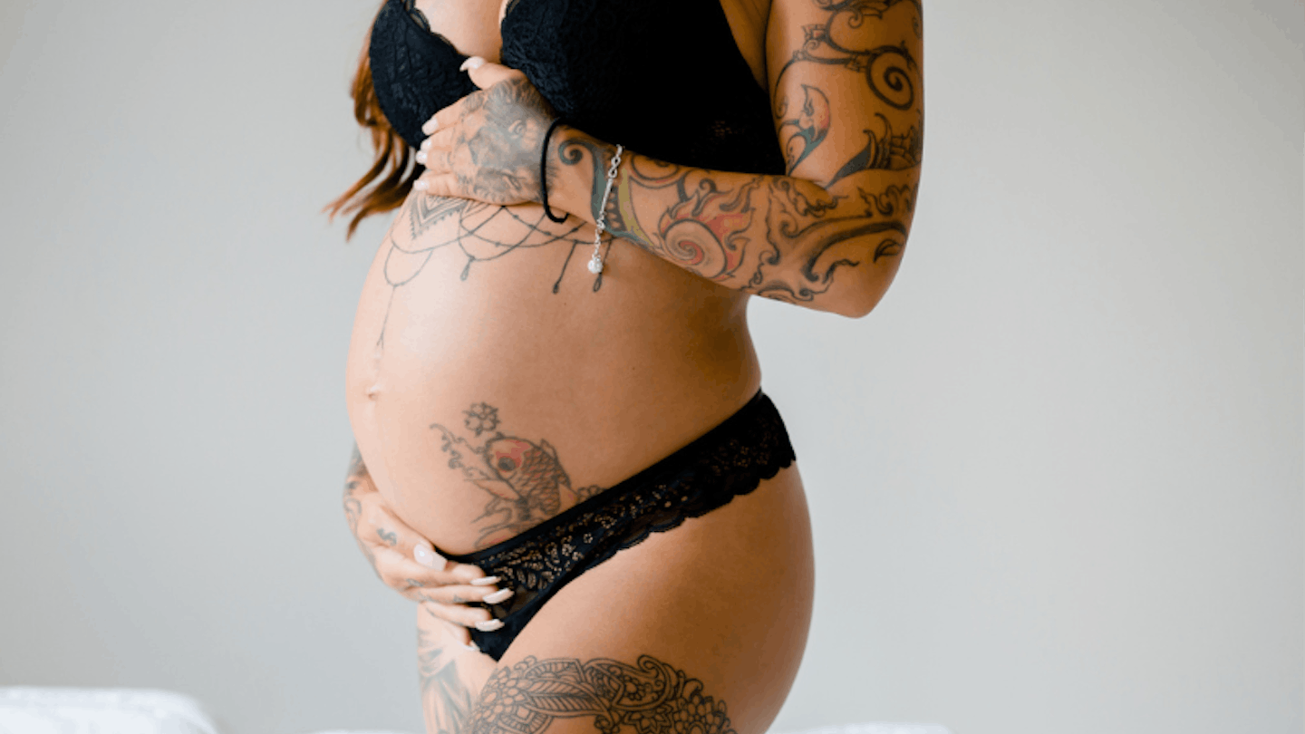 Pregnant woman with tattoo