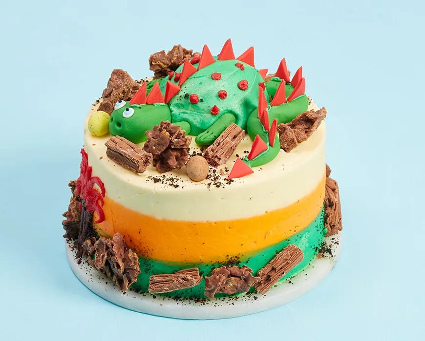 Rex London - We absolutely love this dino cake by Litty's Larder! It  features edible boulders and grass, dino footprints and our wooden  triceratops puzzle as a unique topper 🎂 | Facebook
