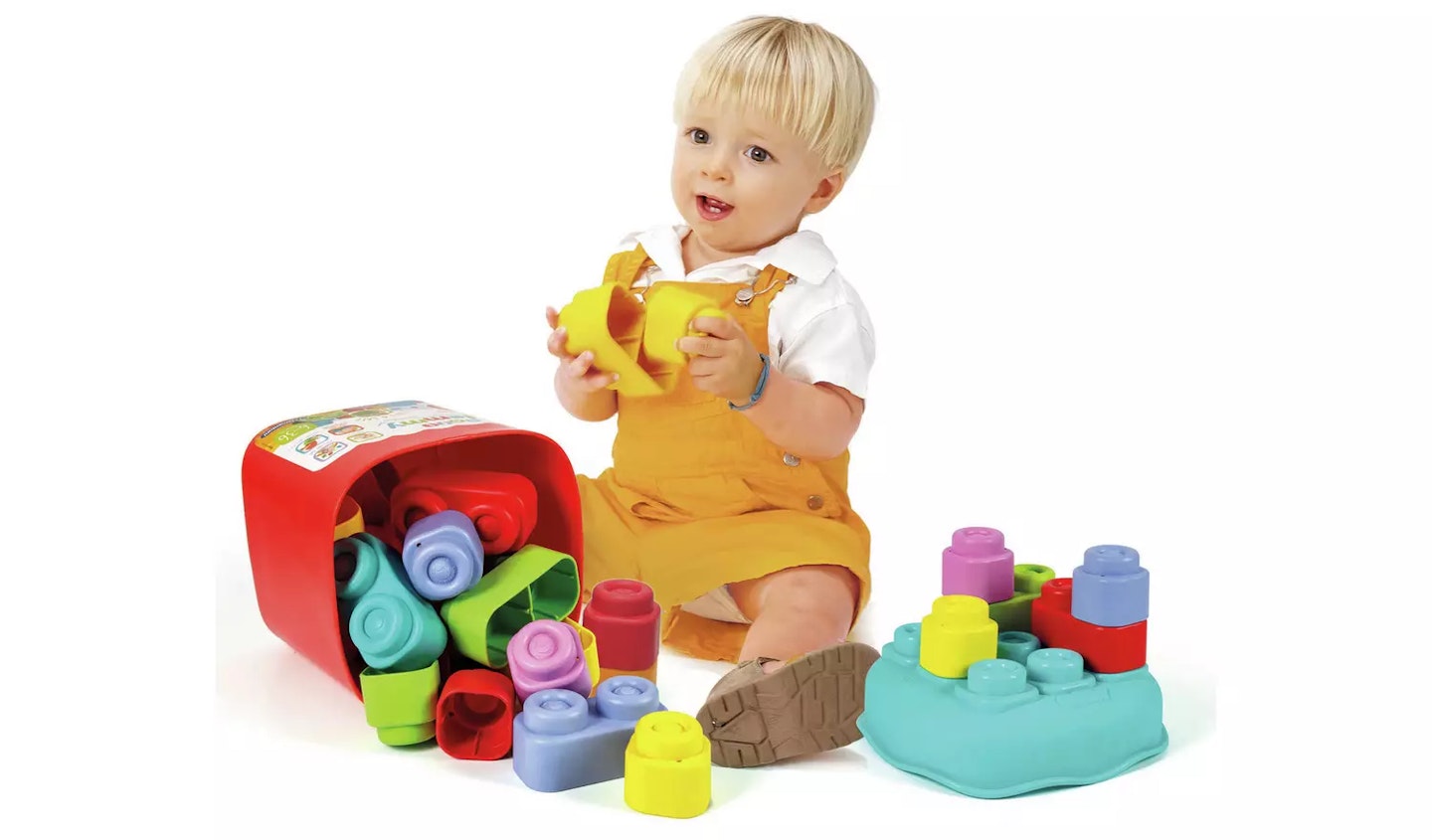 Baby boy playing with soft blocks 