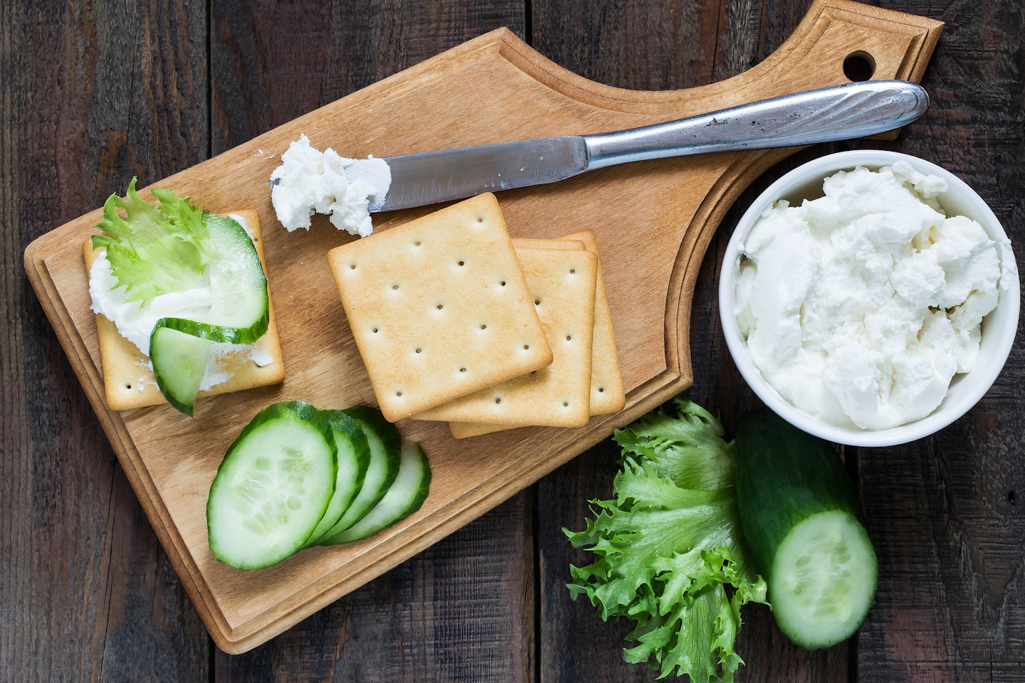 Oat or rye crackers with cheese and cucumber