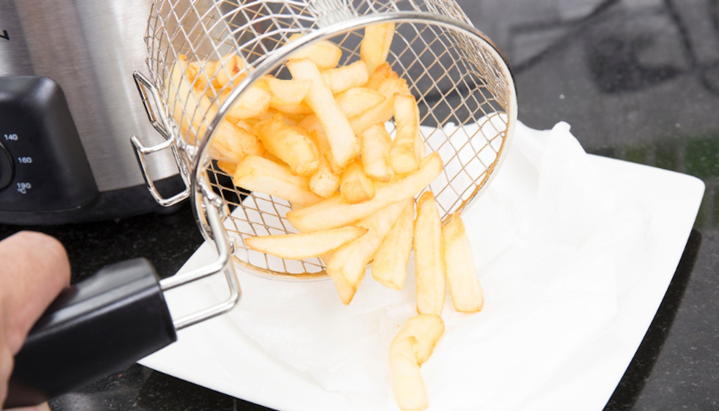 Air fryer chips tipped onto liner