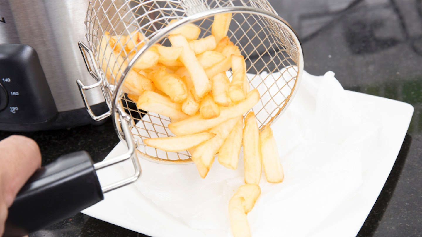 Air fryer chips tipped onto liner