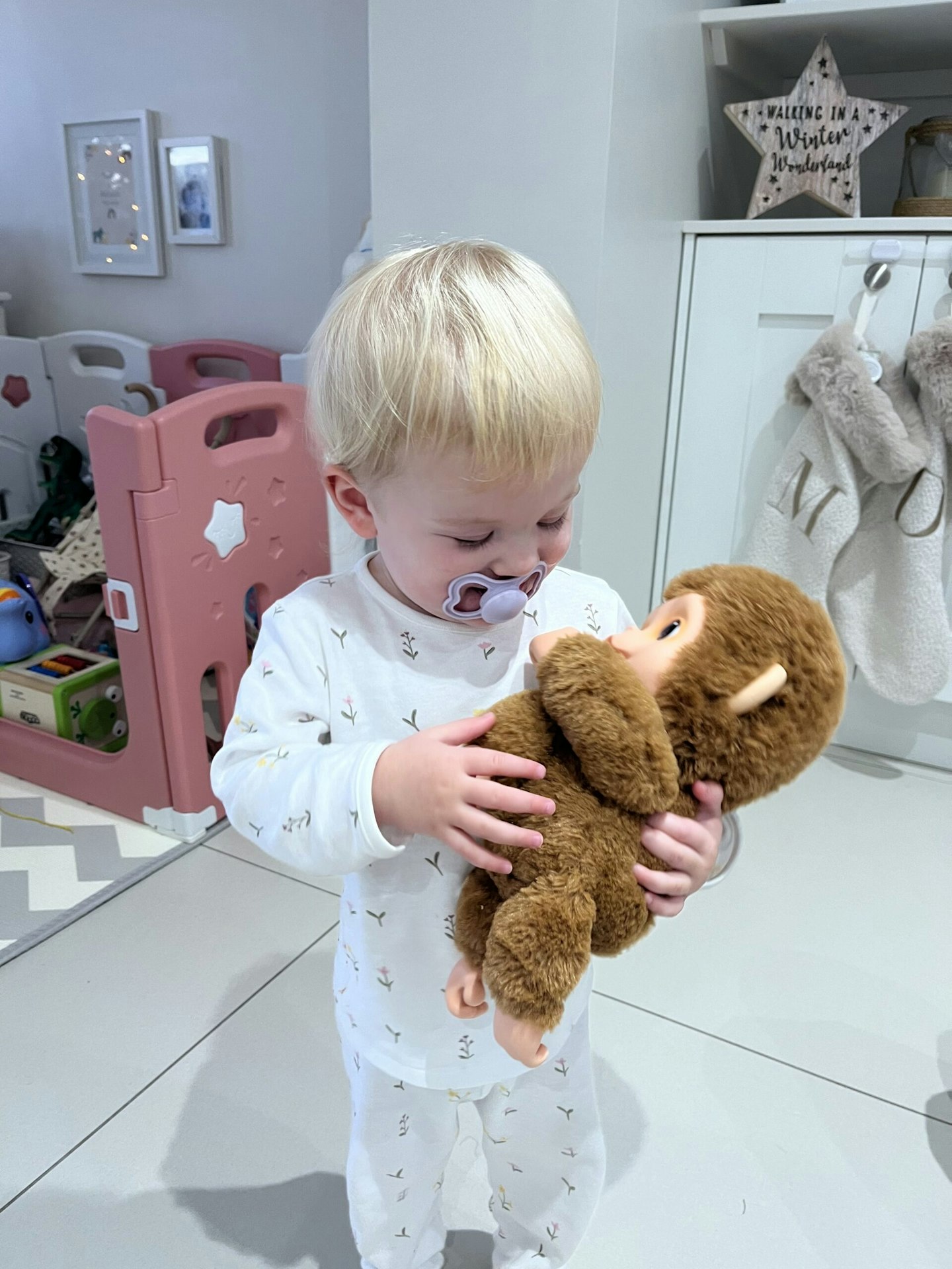 Child playing with Little Live Pets monkey Mango