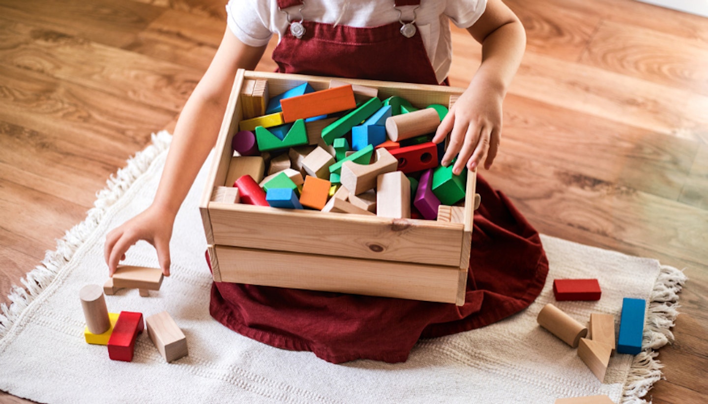 Child with box of toys