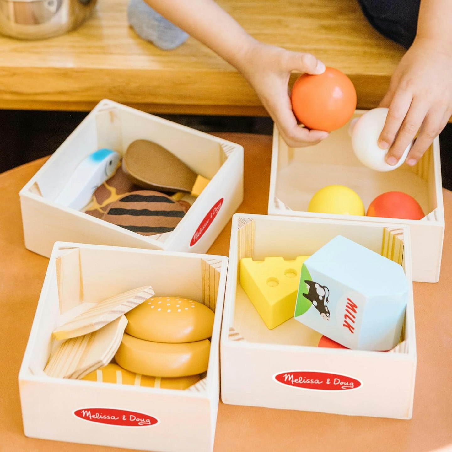 Wooden play food with four crates to separate food groups