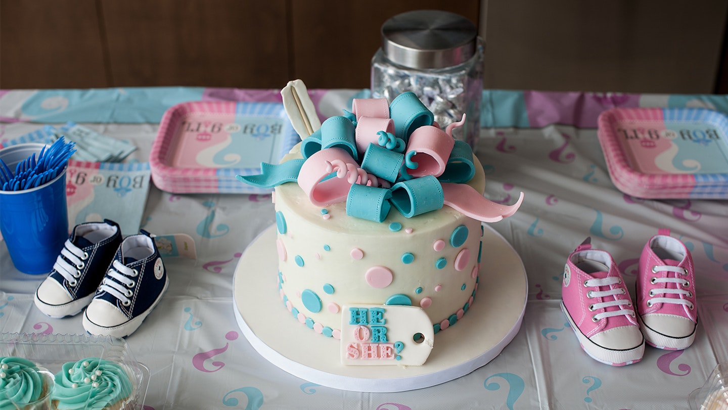 Party favors on a table for the baby revealing party announcing the arrival of a new baby.