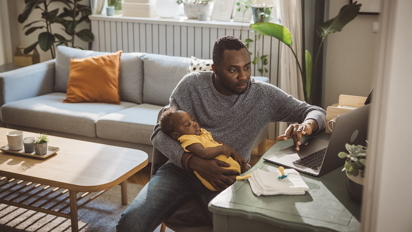 Dad working with baby