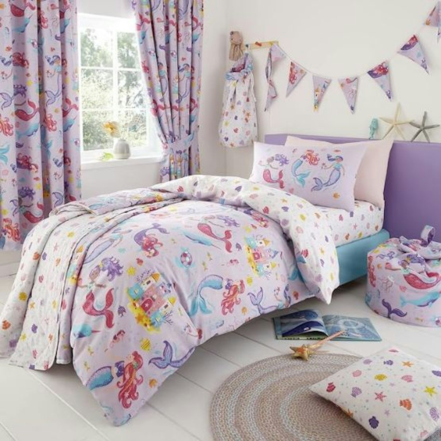 Mermaid duvet cover in a room with matching curtains, bunting, beanbag and throw 