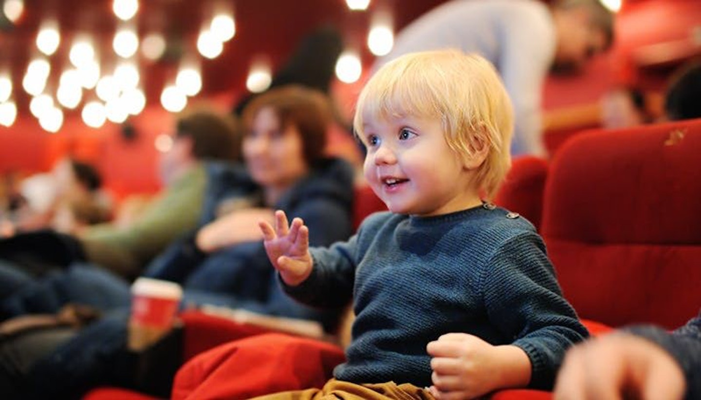 Little boy at the theatre or cinema