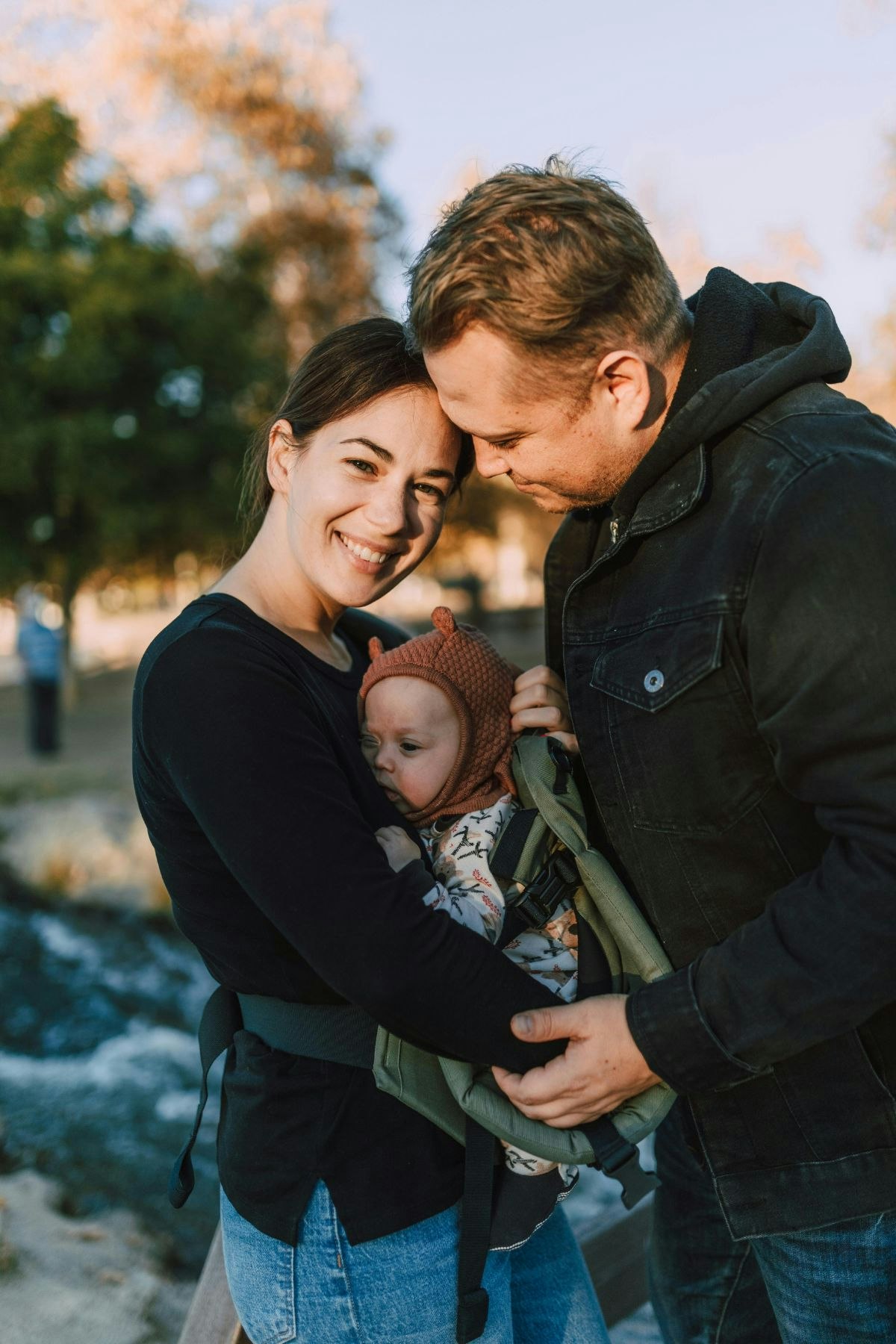 Family outdoor walk baby in a sling