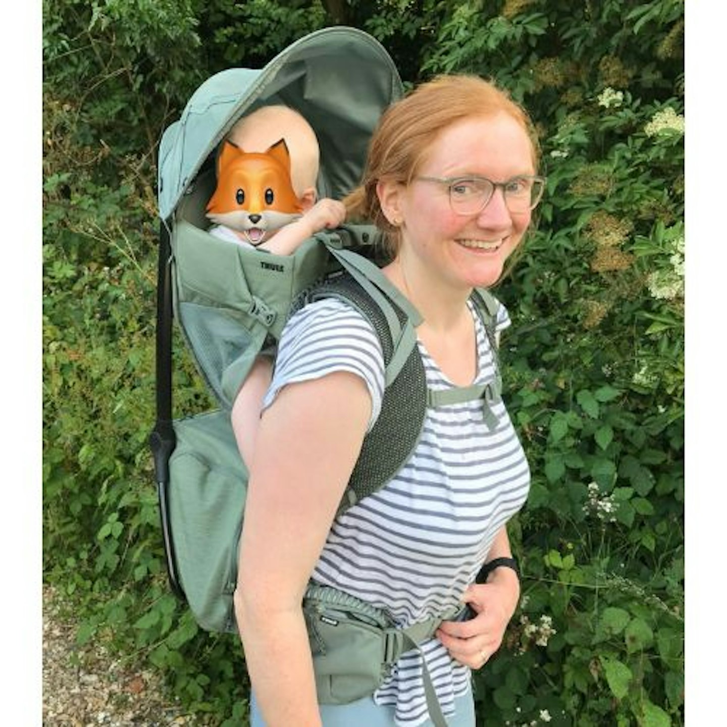 Kate wearing the Thule Sapling Backpack Carrier with her child in