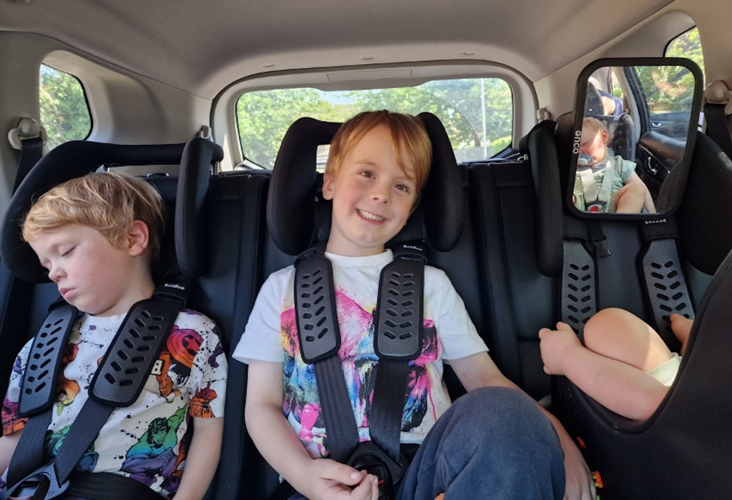 all three young children in the back of a car in the Multimac Three Seater Car Seat, and Minimac