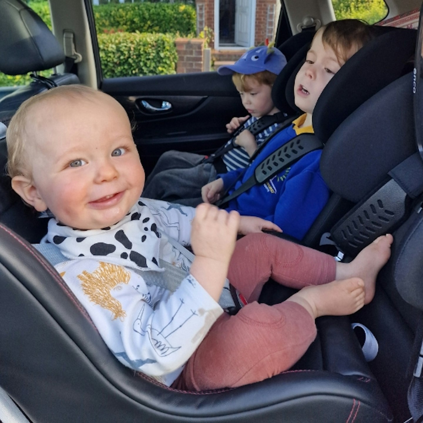 all three young children in the back of a car in the Multimac Three Seater Car Seat, and Minimac