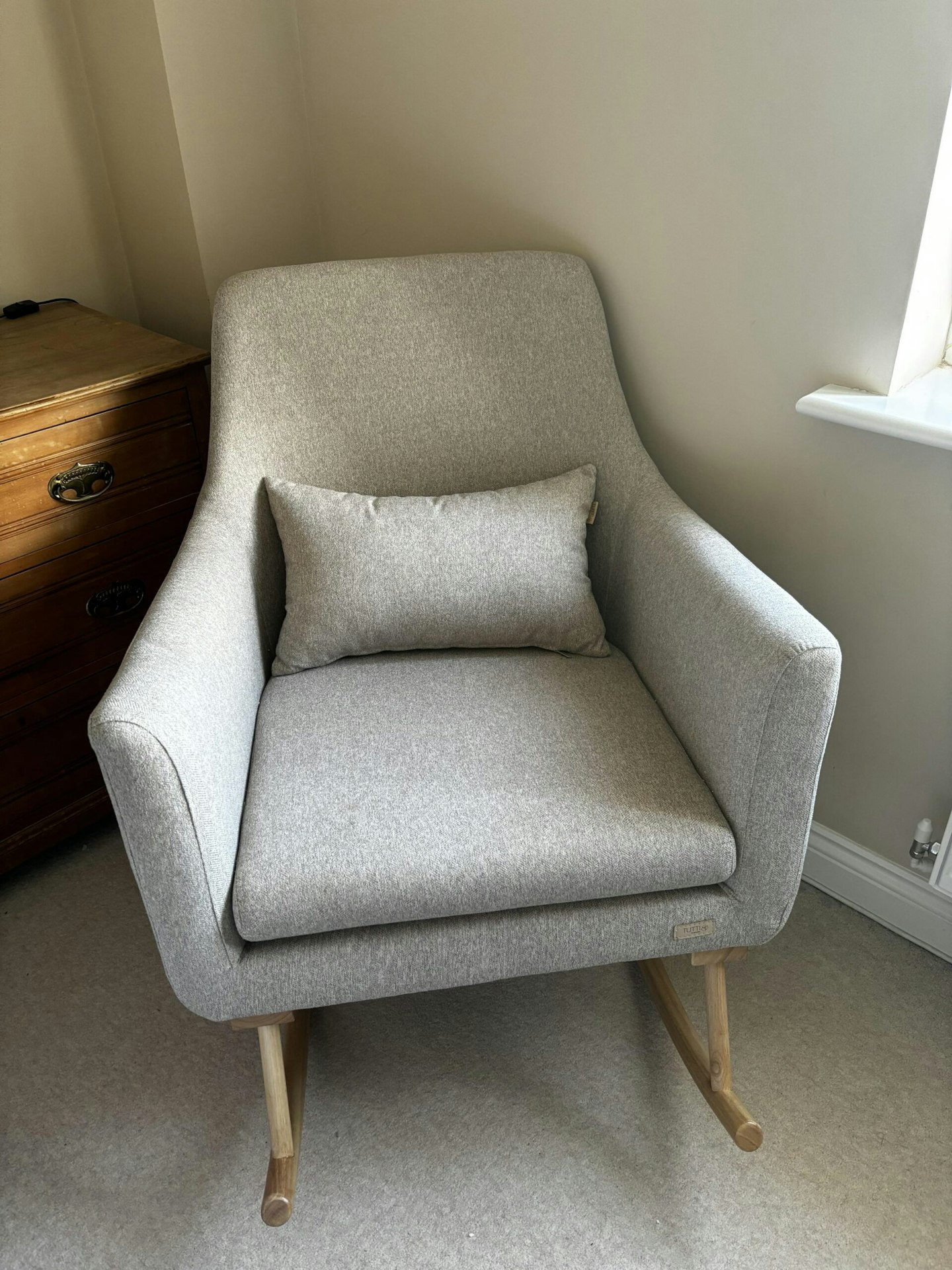 Tutti Bambini Oscar Rocking Chair in the shade Stone in the corner of the room