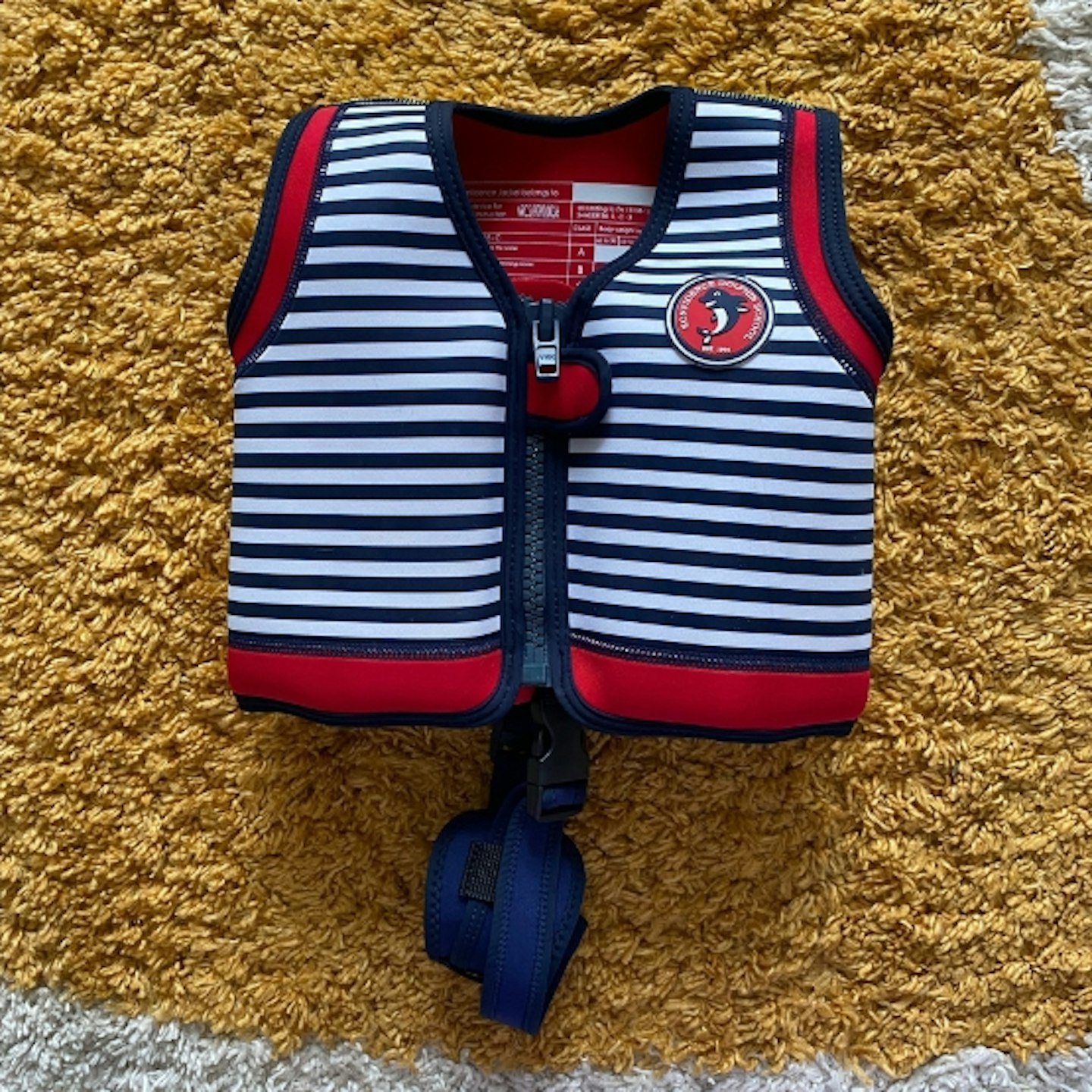 Konfidence Swim Jacket with blue and white stripes and red border details around the bottom and arms