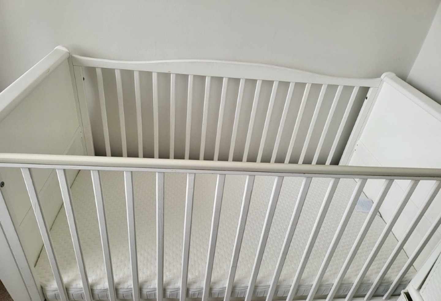 Obaby Moisture Management Dual Core Mattress inside a white cot