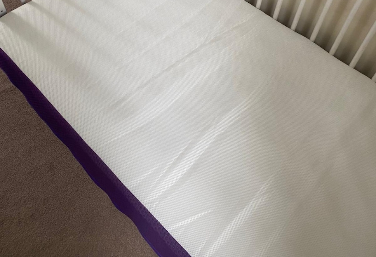 close up photo of the Snuz Surface Pro Duo Cot Mattress, showing the top