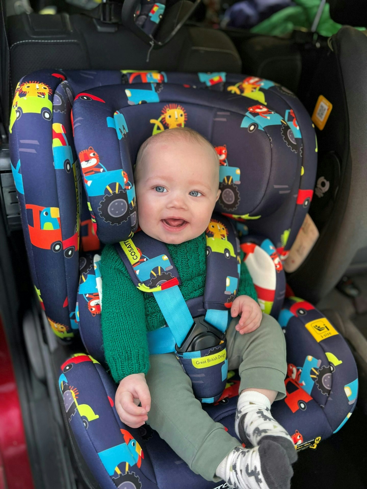 Baby sitting in the Cosatto All in All 5 point harness car seat