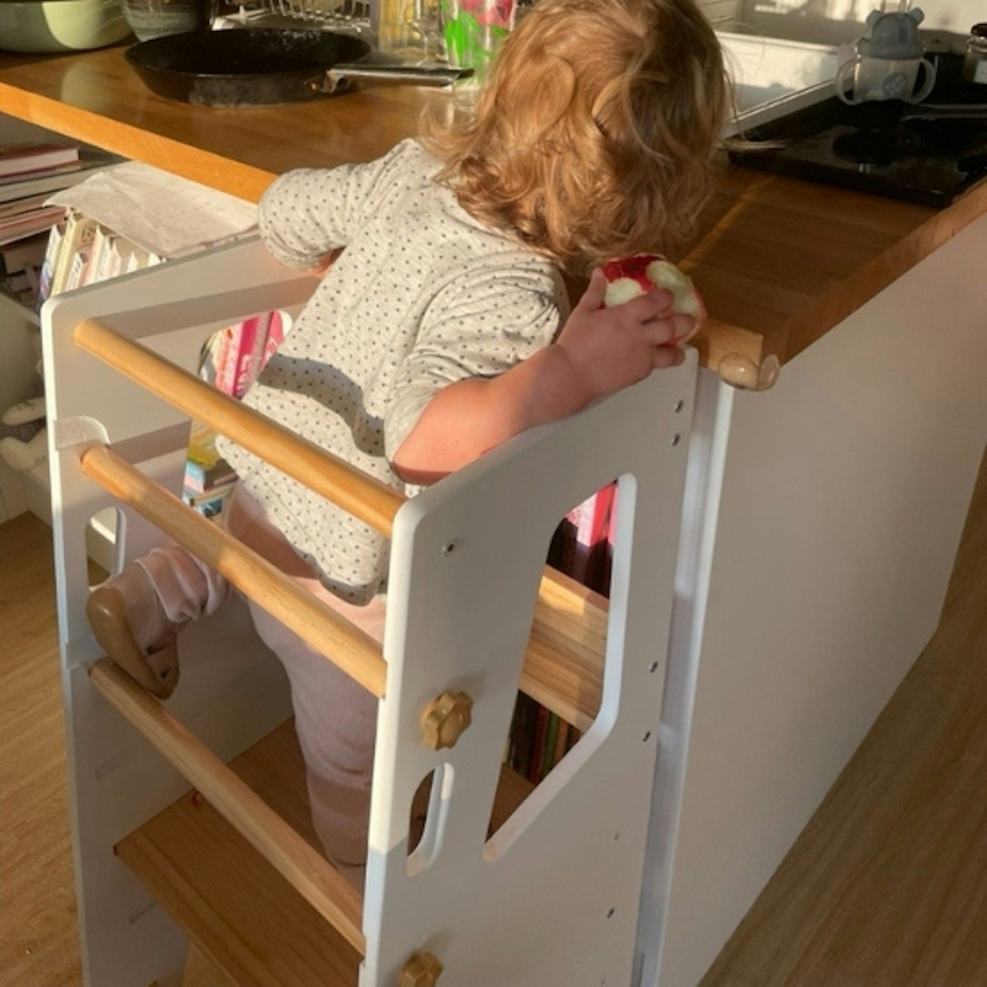 young child in the Cara Mia Chef toddler tower at the kitchen counter