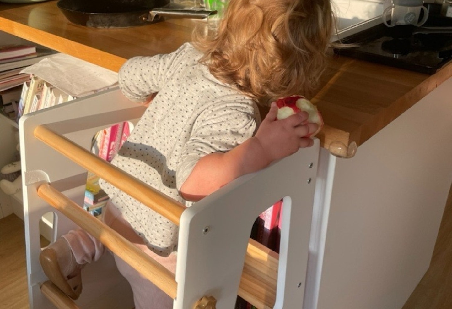 young child in the Cara Mia Chef toddler tower at the kitchen counter