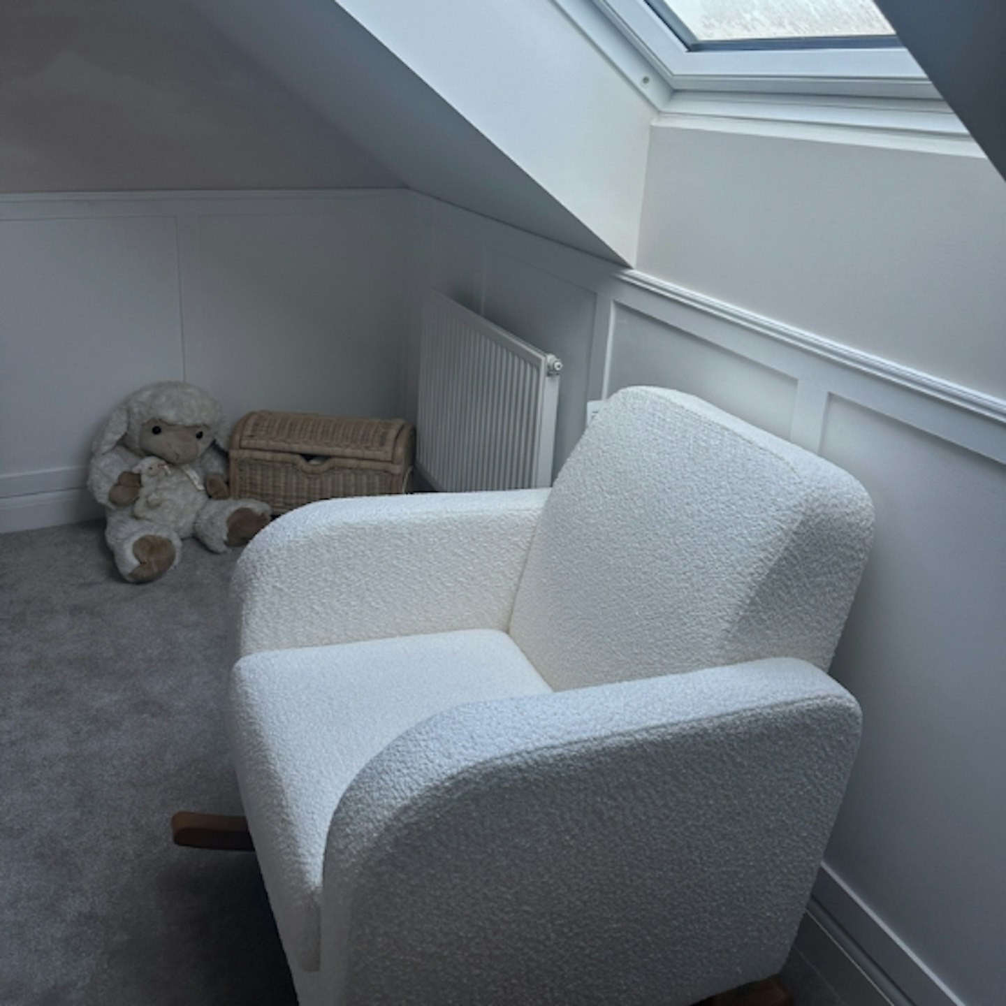 Cuddleo Etta Rocker in baby's new nursery room near window