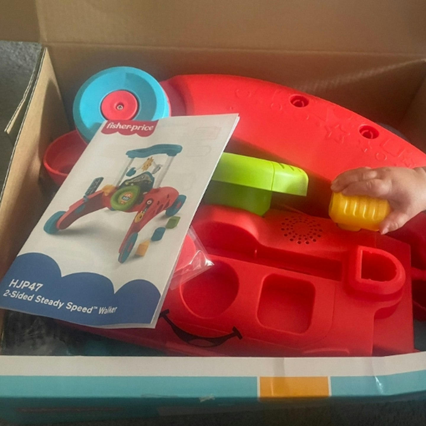 Fisher-Price 2-sided steady speed walker in the packaging box