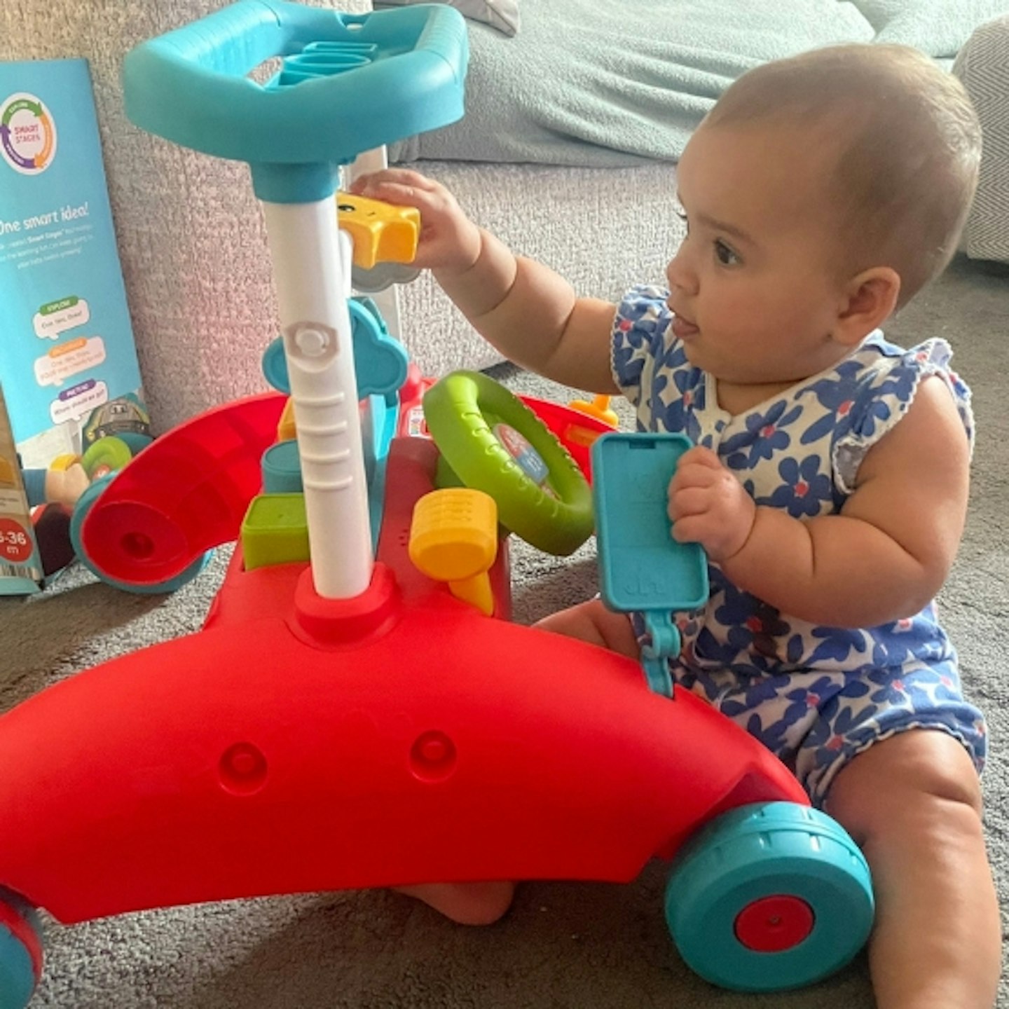 baby playing with Fisher-Price 2-sided steady speed walker