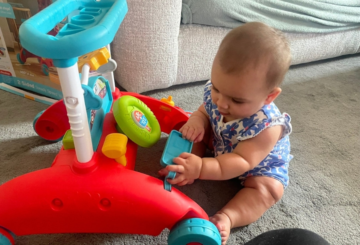 baby playing with Fisher-Price 2-sided steady speed walker