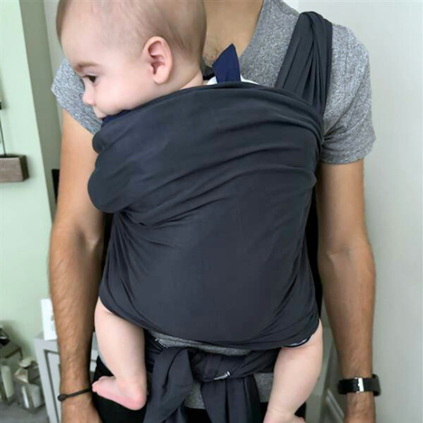 Baby being carry with the Izmi Baby Wrap