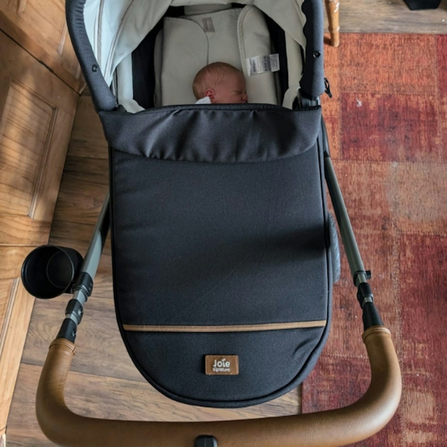 baby in the carrycot attachment on the Joie Finiti