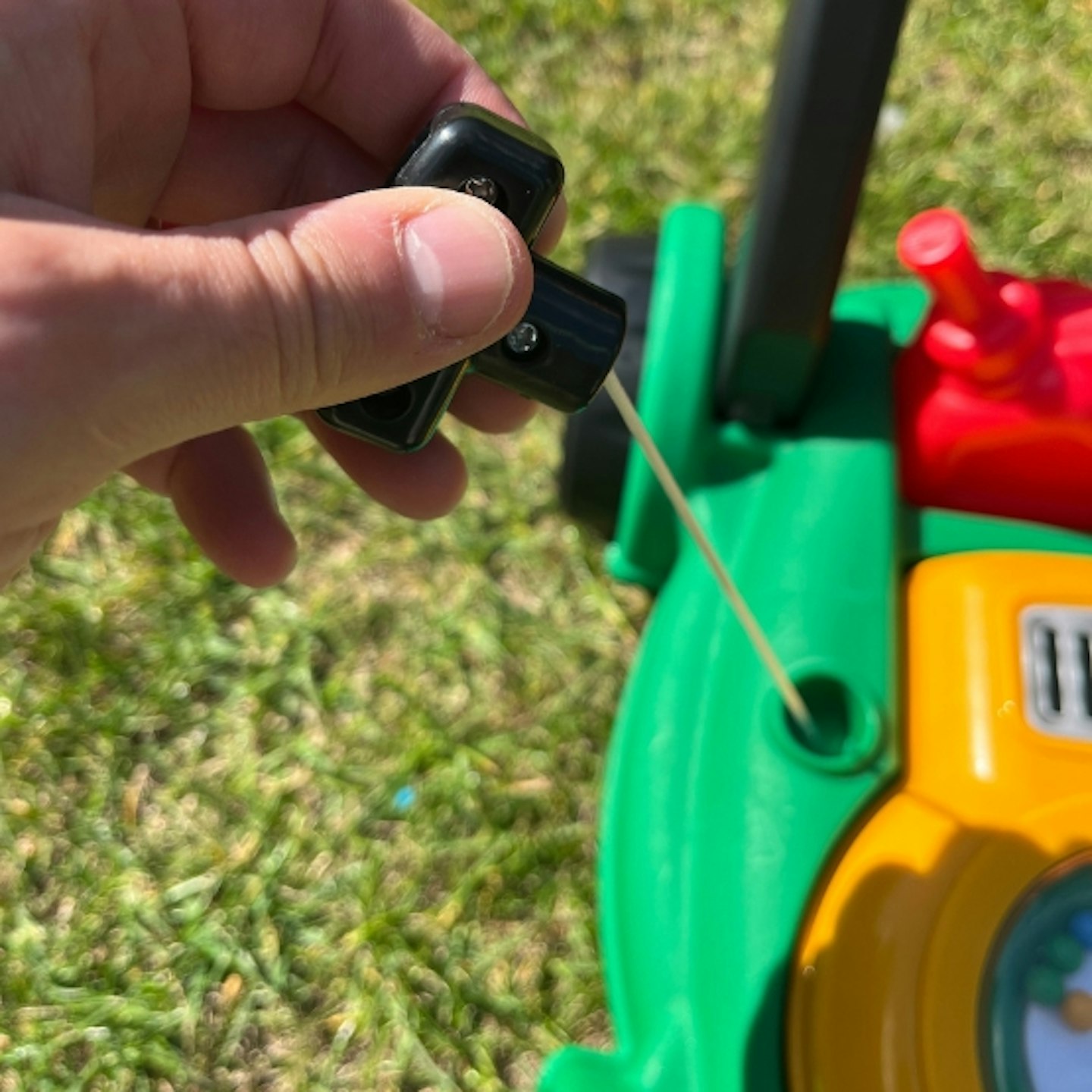 pull string on the Little Tikes Lawnmower