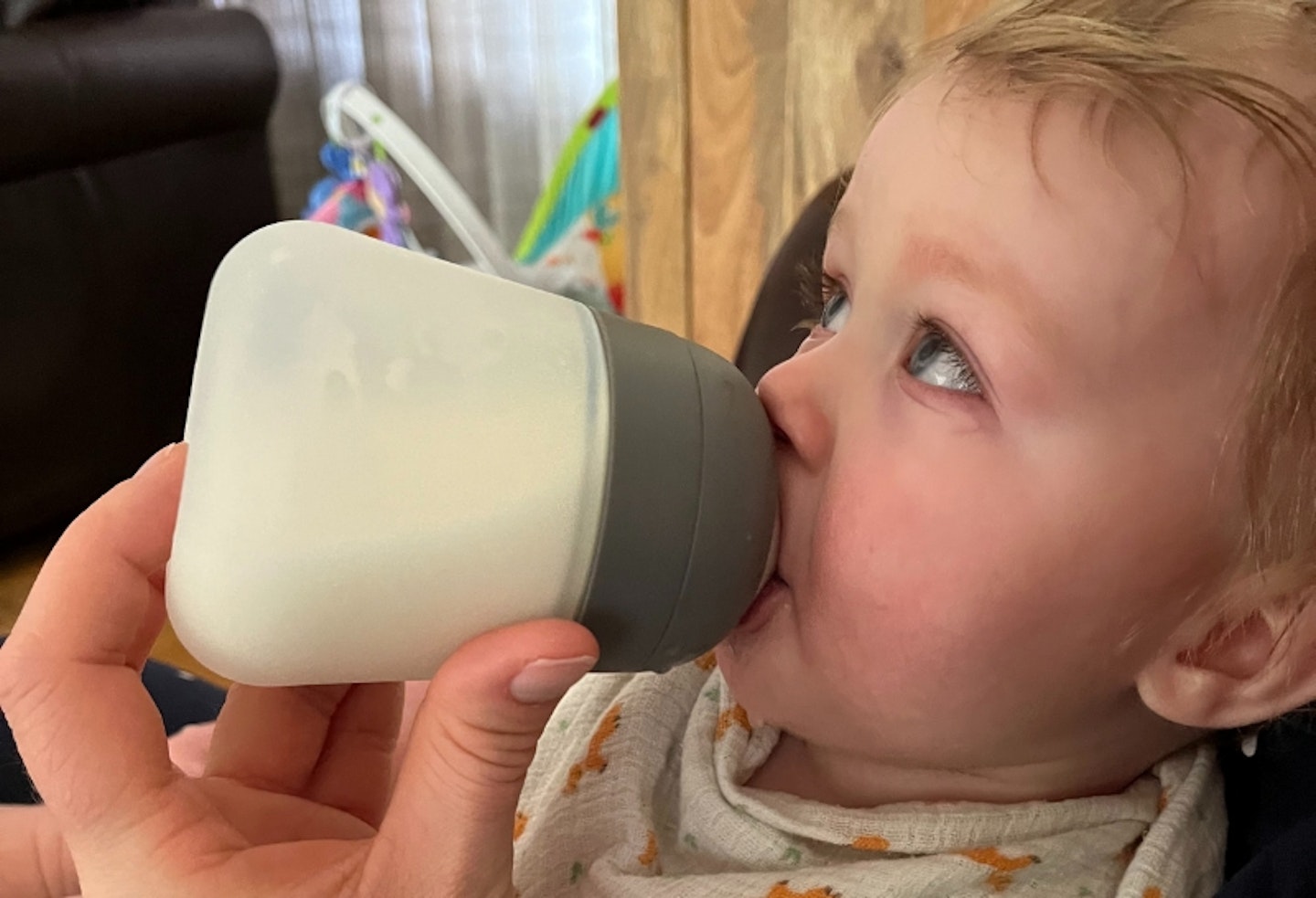 young child being fed with a Nanobebe Flexy Silicone Baby Bottle