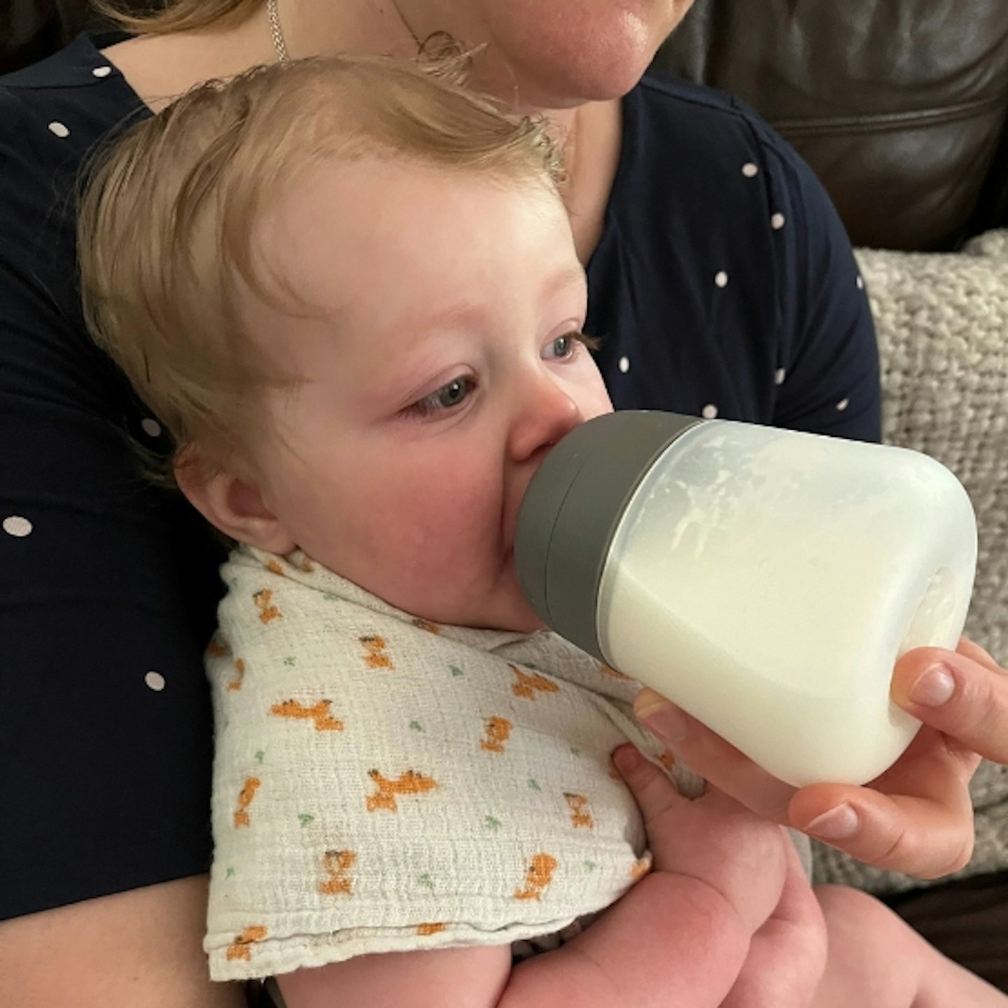 young child being fed with a Nanobebe Flexy Silicone Baby Bottle