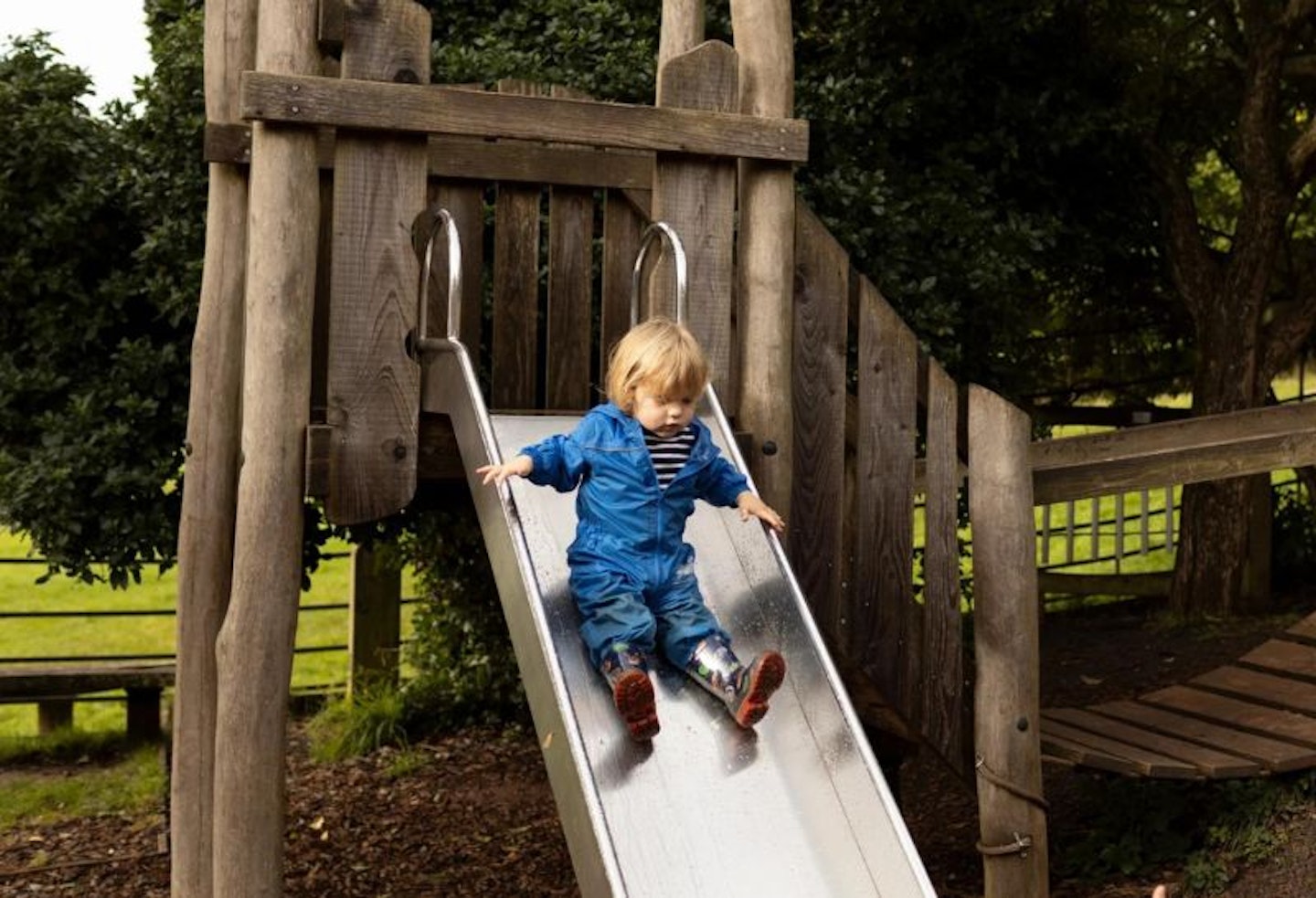 Child playing on the playground at Killerton National Trust property