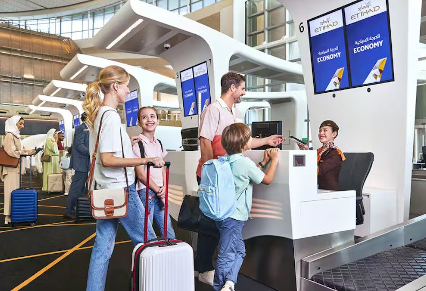 Family checking in for Etihad Airways flight