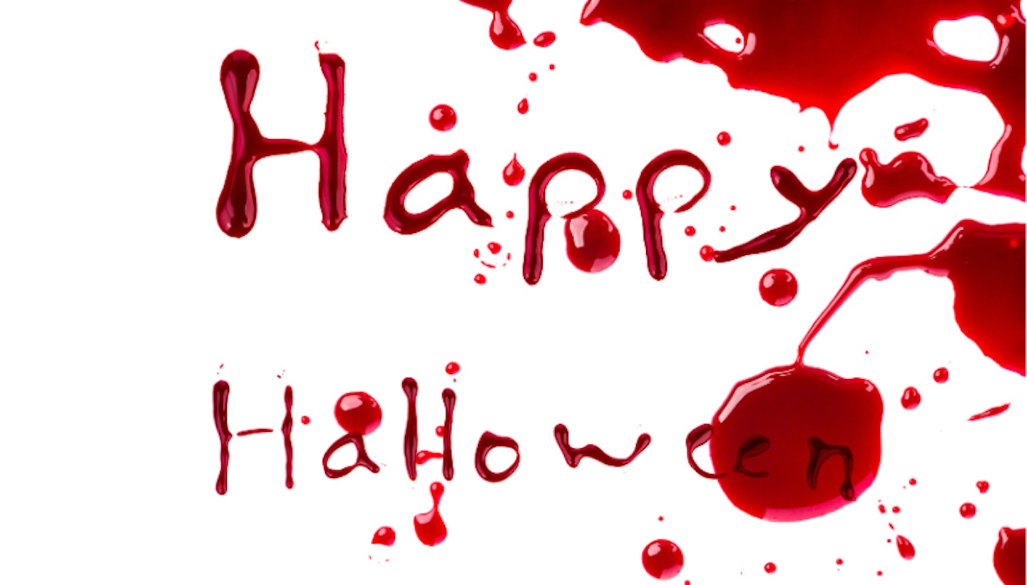 "Happy Halloween" written in fake blood on white background