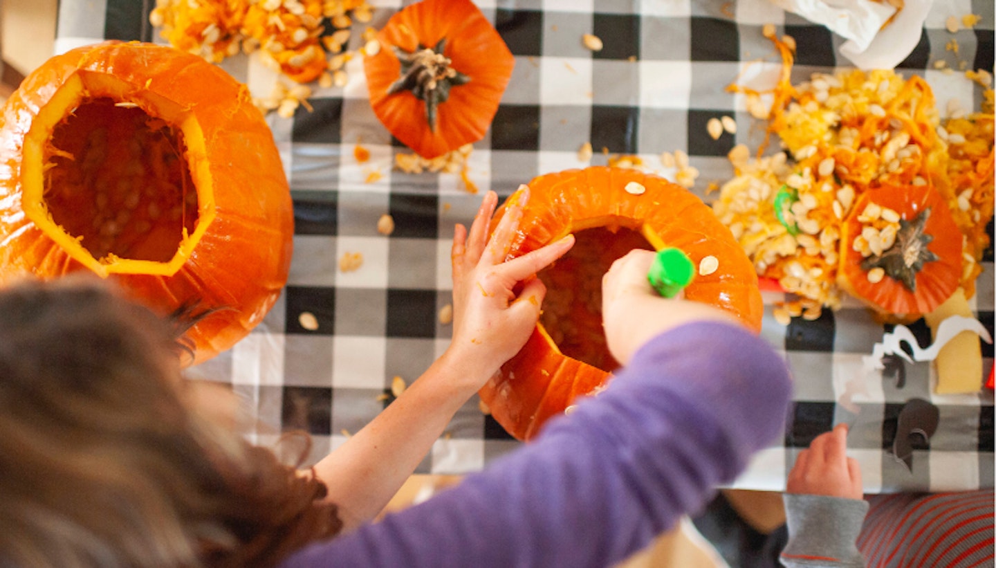 Messy pumpkin carving