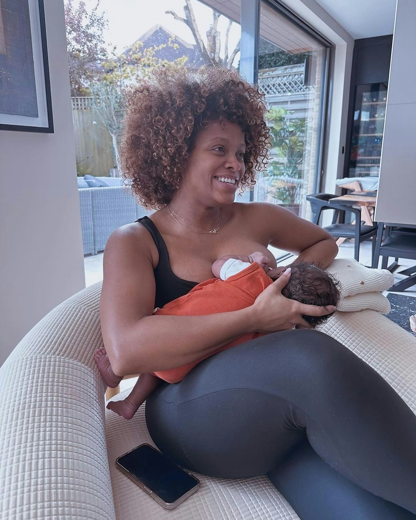 Fleur East breastfeeding her daughter Nova