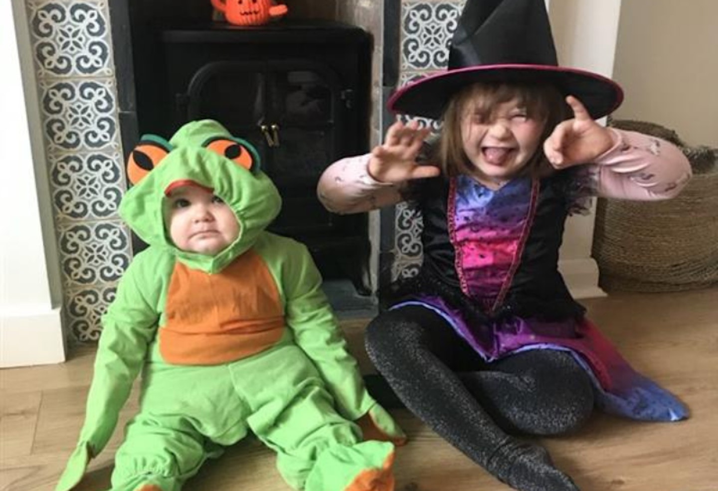 Sisters dressed as a witch and frog